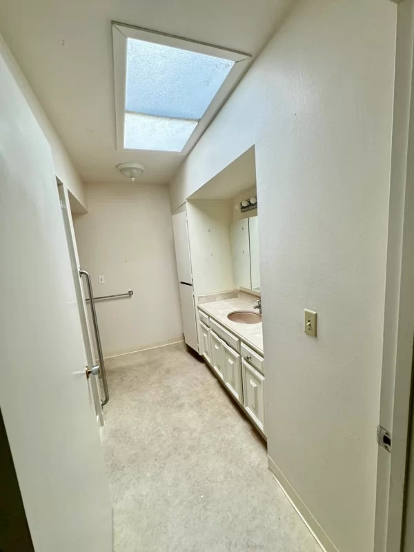 old bathroom in need of tiles and countetop