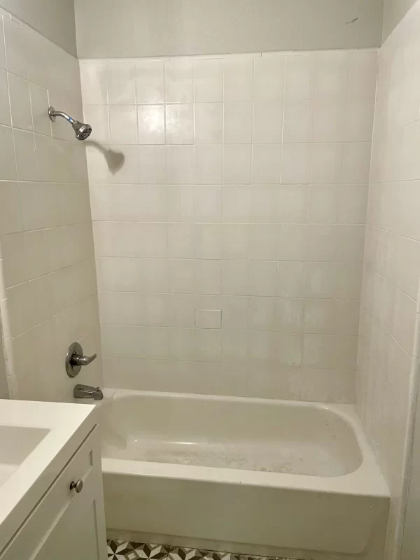 shower walls unfinished and old in need of an upgrade